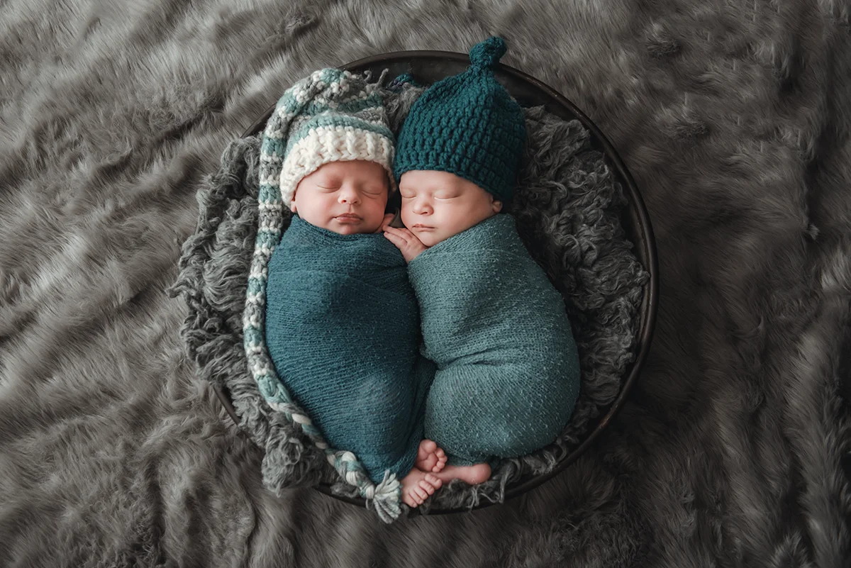 Boston Twin photographer caryn scanlan took this picture of twins at a newborn session at a few weeks old