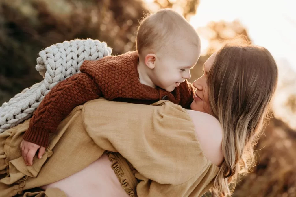 Boston Maternity Photographer Caryn Scanlan photographed this mom and her child at a family photoshoot on a beach on the South Shore near Boston, MA