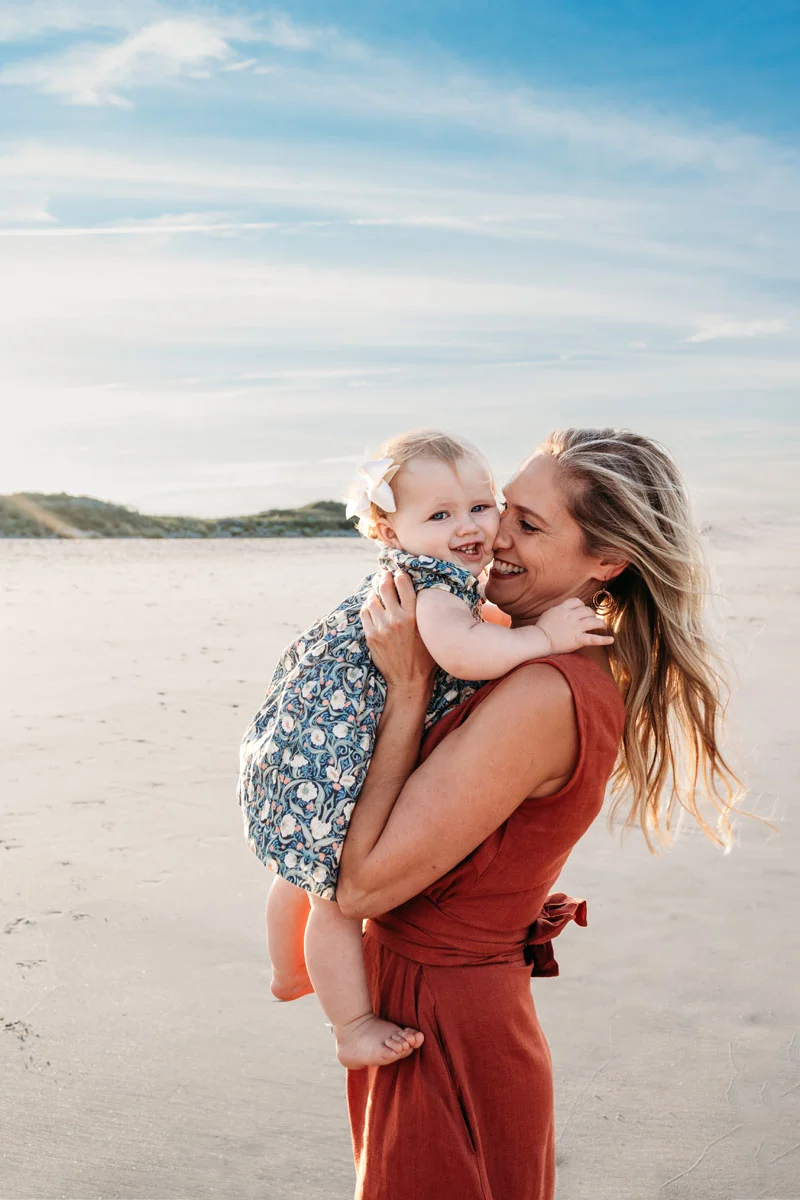 Plymouth Family Photographer Caryn Scanlan photographed this mom and her baby at a family photoshoot on a beach on the South Shore near Plymouth, MA