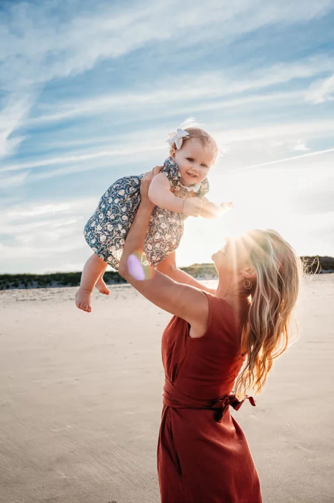 Plymouth Family Photographer Caryn Scanlan photographed this mom and her baby at a family photoshoot on a beach on the South Shore near Plymouth, MA