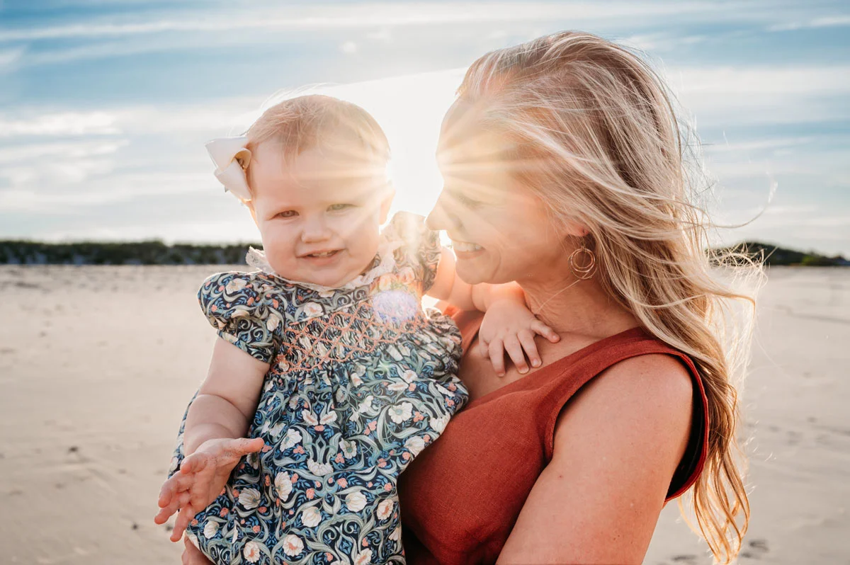 Plymouth Family Photographer Caryn Scanlan photographed this mom and her baby at a family photoshoot on a beach on the South Shore near Plymouth, MA