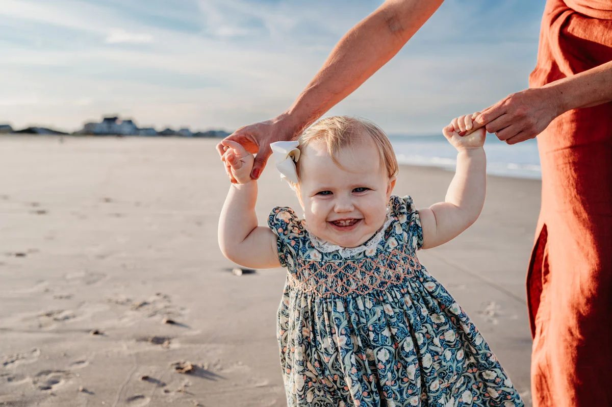 Plymouth Family Photographer Caryn Scanlan photographed this mom and her baby at a family photoshoot on a beach on the South Shore near Plymouth, MA