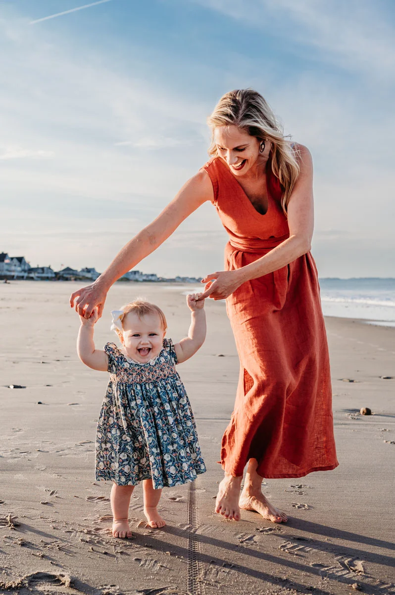 Plymouth Family Photographer Caryn Scanlan photographed this mom and her baby at a family photoshoot on a beach on the South Shore near Plymouth, MA