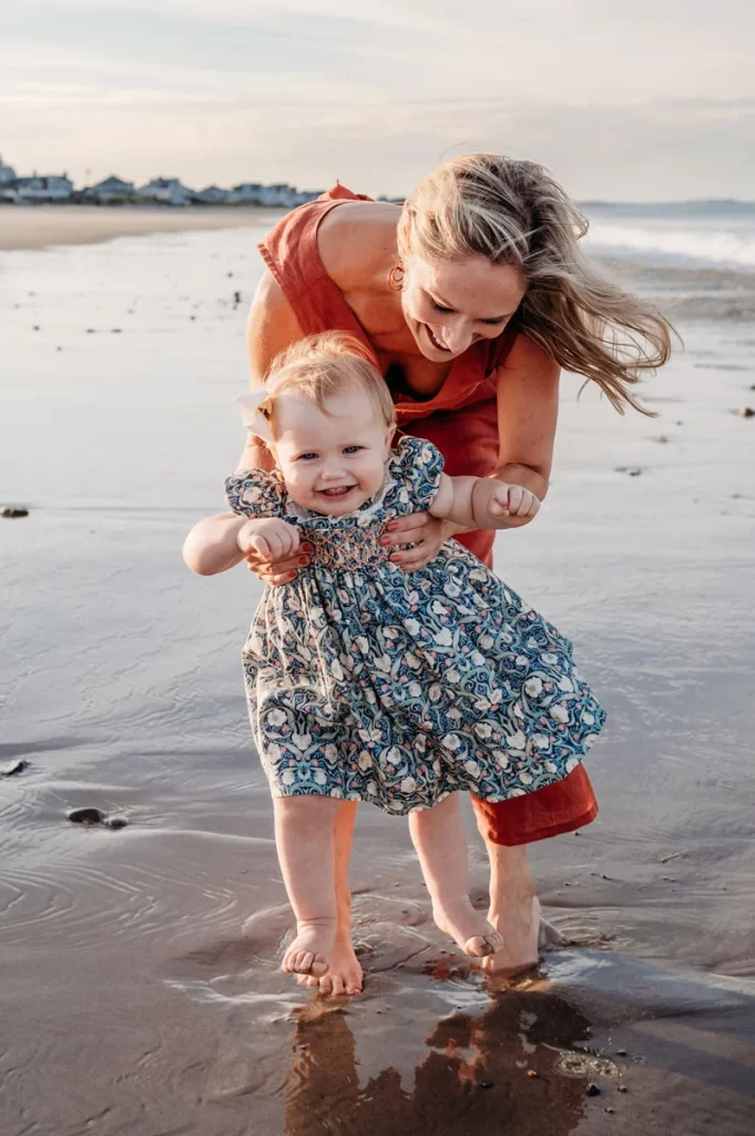 Plymouth Family Photographer Caryn Scanlan photographed this mom and her baby at a family photoshoot on a beach on the South Shore near Plymouth, MA