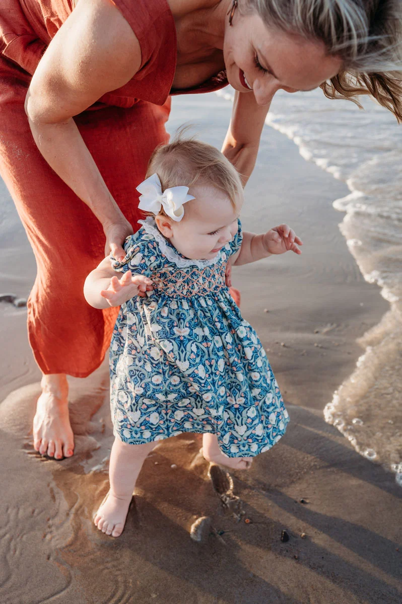 Plymouth Family Photographer Caryn Scanlan photographed this mom and her baby at a family photoshoot on a beach on the South Shore near Plymouth, MA