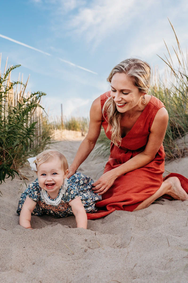 Plymouth Family Photographer Caryn Scanlan photographed this mom and her baby at a family photoshoot on a beach on the South Shore near Plymouth, MA