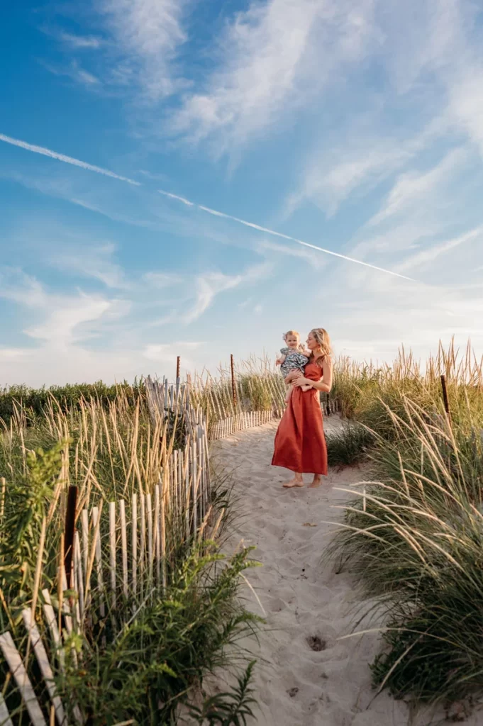 Plymouth Family Photographer Caryn Scanlan photographed this mom and her baby at a family photoshoot on a beach on the South Shore near Plymouth, MA