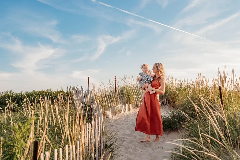 Plymouth Family Photographer Caryn Scanlan photographed this mom and her baby at a family photoshoot on a beach on the South Shore near Plymouth, MA