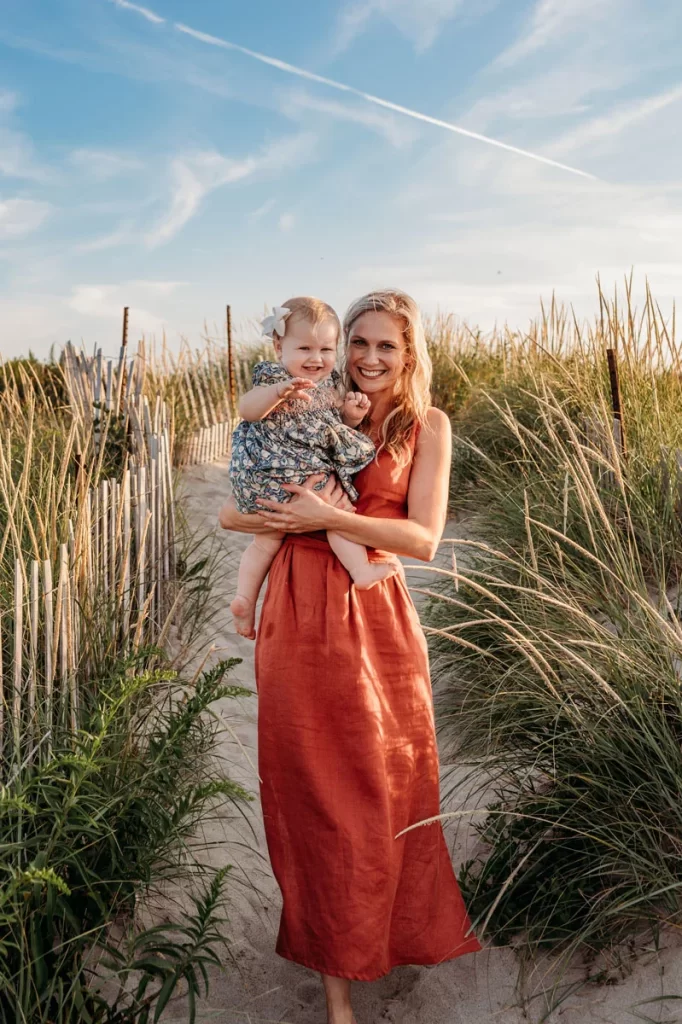 Plymouth Family Photographer Caryn Scanlan photographed this mom and her baby at a family photoshoot on a beach on the South Shore near Plymouth, MA