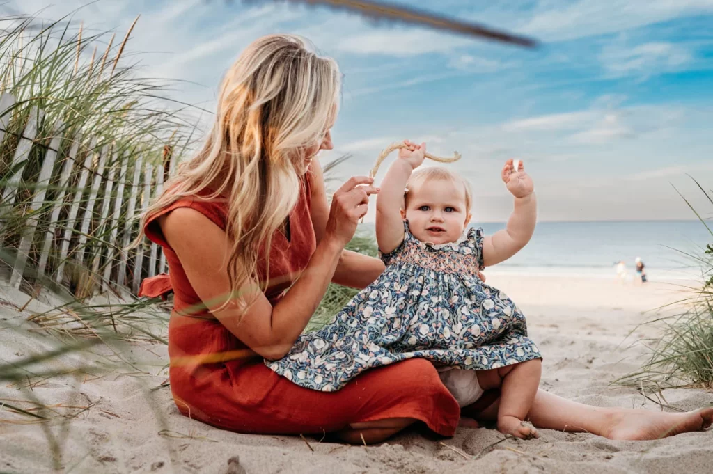 Plymouth Family Photographer Caryn Scanlan photographed this mom and her baby at a family photoshoot on a beach on the South Shore near Plymouth, MA