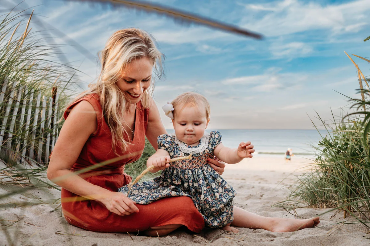 Plymouth Family Photographer Caryn Scanlan photographed this mom and her baby at a family photoshoot on a beach on the South Shore near Plymouth, MA