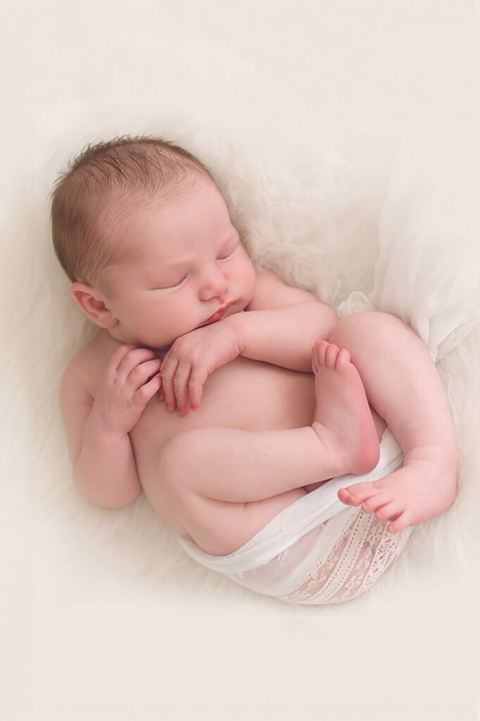 Newborn baby in a photoshoot in Plymouth, MA by Caryn Scanlan