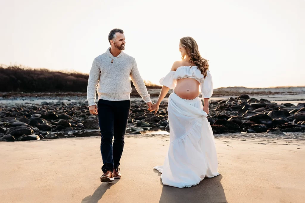 boston maternity photographer Caryn Scanlan photographed this couple expecting their baby on a beach in gloucester, ma