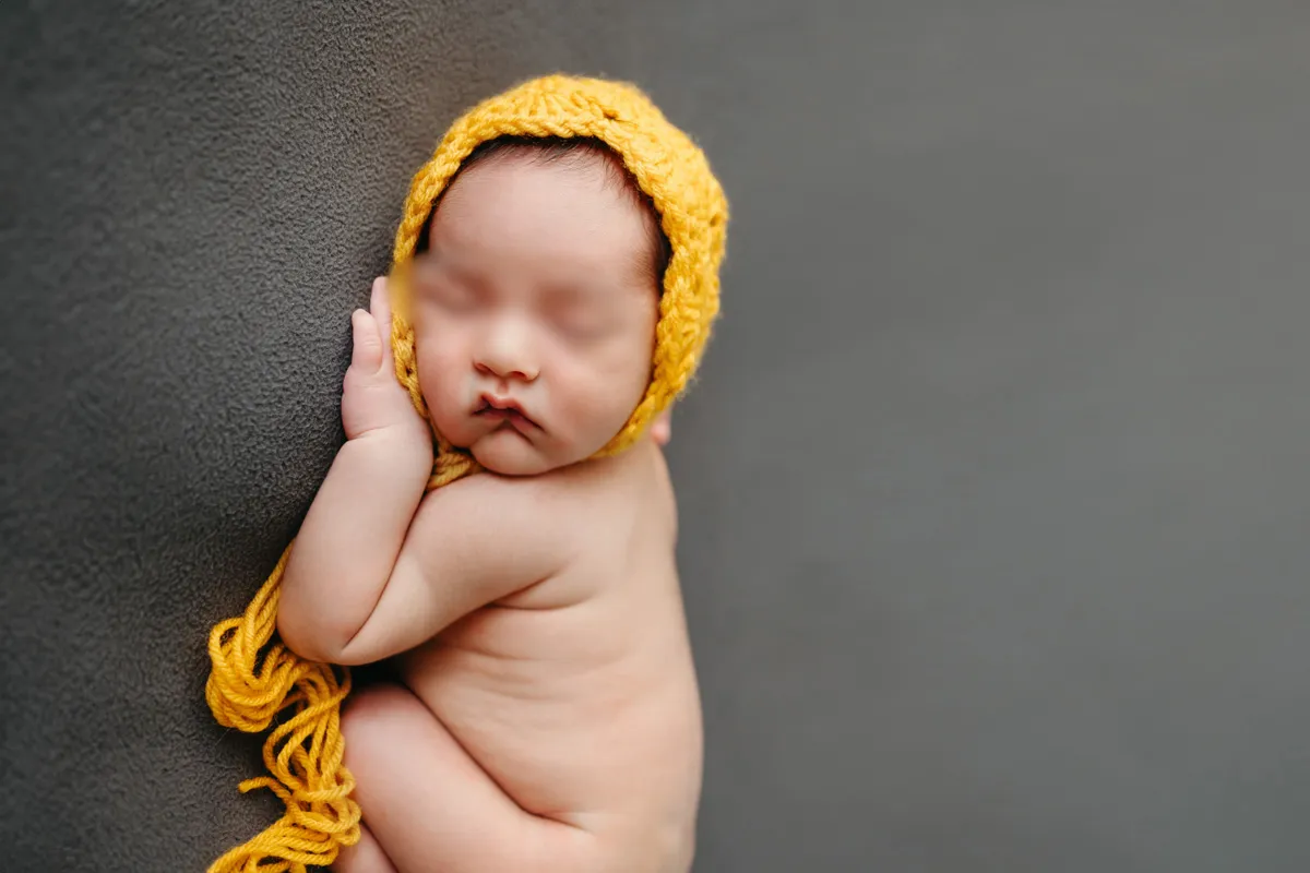 In-home newborn session in Boston by Caryn Scanlan in yellow