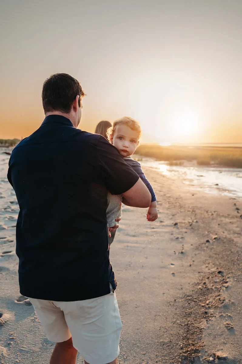 Caryn Scanlan Cape Cod Photographer Dad walking with his son on the beach at Sunset