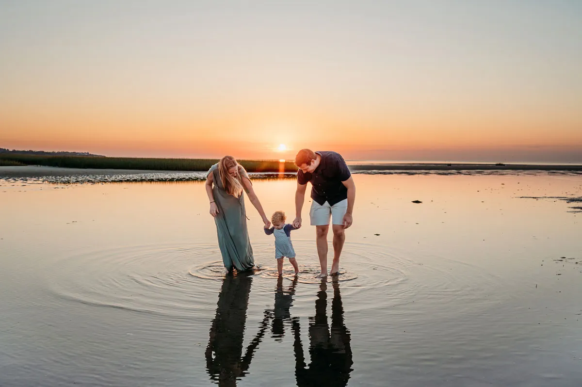 Caryn Scanlan Cape Cod Photographer Family with a sunset water reflection on the beach at Sunset