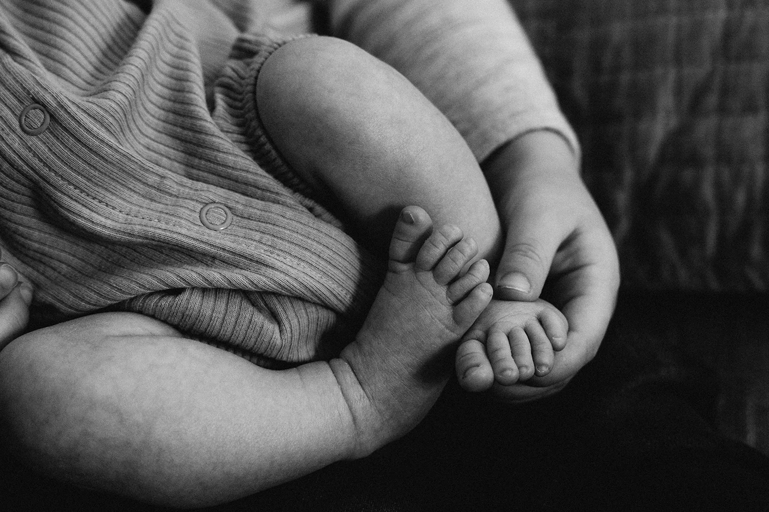 Cape Cod Family Photographer photo of baby's toes in sibling's hand